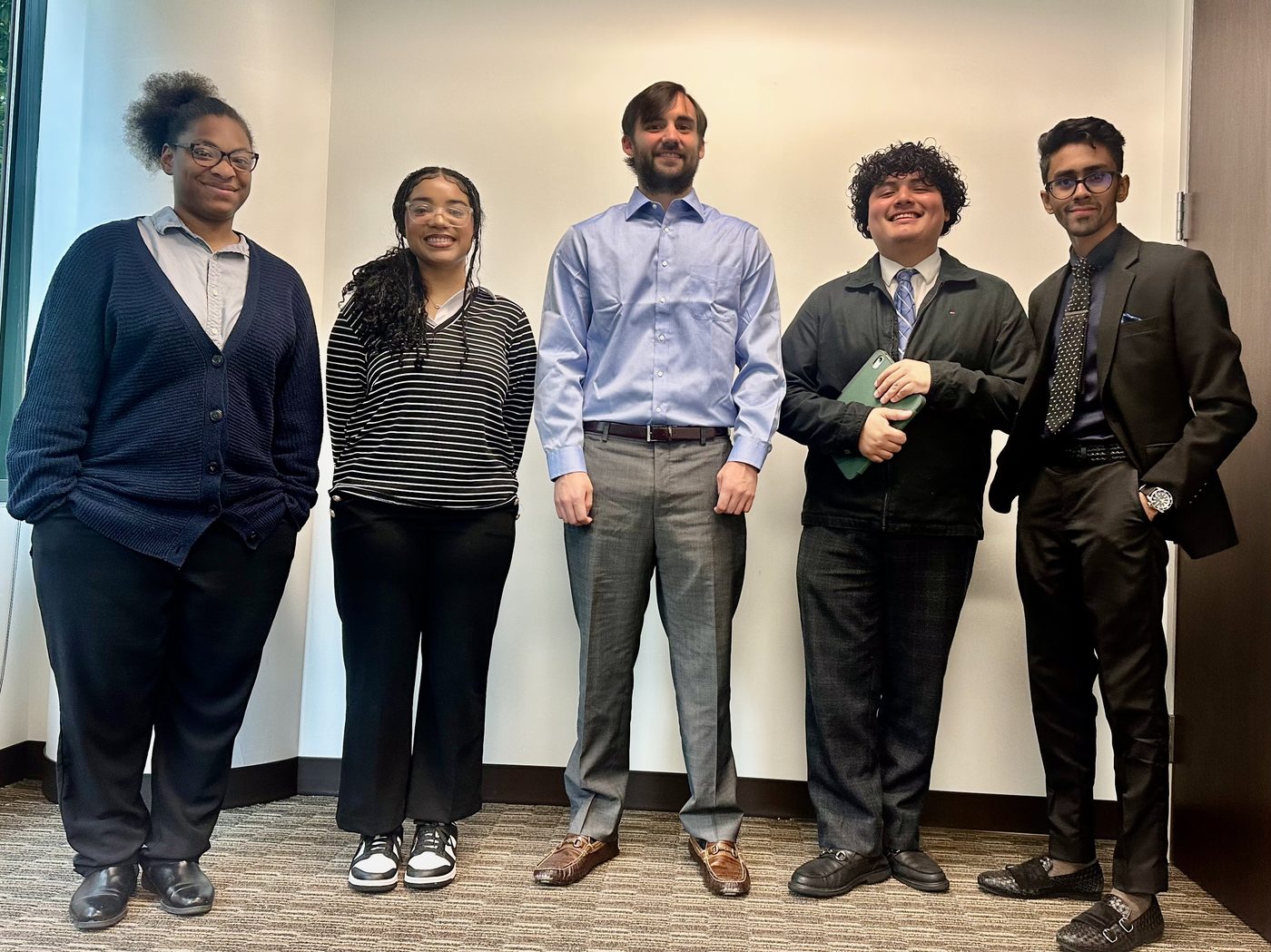 Summit Ridge team group photo showing diverse team members