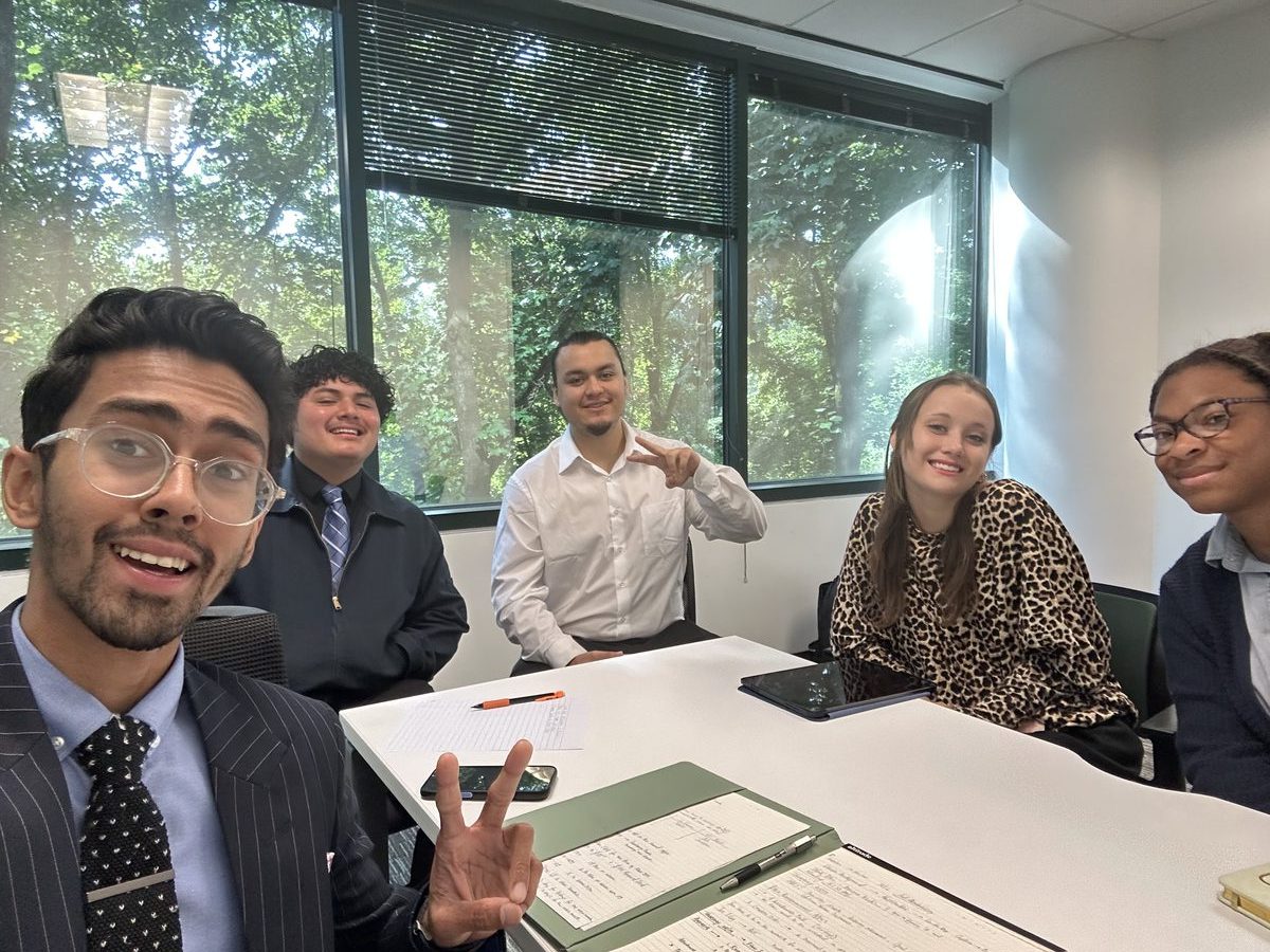 Summit Ridge Group Inc. team collaborating around a table during a training session